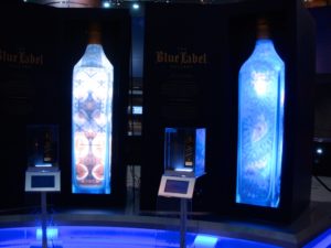 Works by Anrika Rupp (l) and Coral Morphologic (r) in the JOHNNIE WALKER BLUE LABEL Gallery in Miami International Airport