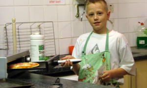 boy cooking pizza